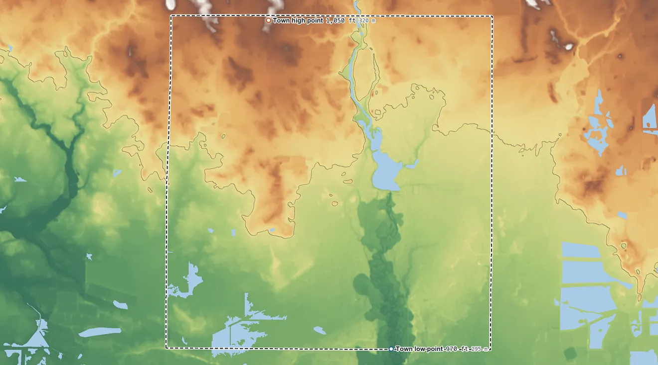 Topographic elevation map of Dexter, Wisconsin, shaded from 970 ft on the south side to 1,050 ft on the north side