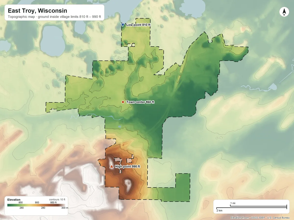 Topographic elevation map of East Troy, Wisconsin, shaded from 810 ft on the north side to 990 ft on the south side