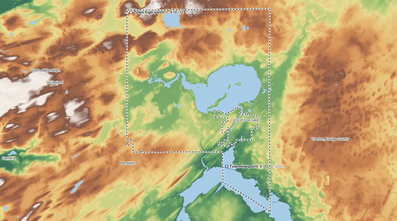 Topographic elevation map of Fox Lake, Wisconsin, shaded from 870 ft on the south side to 1,030 ft on the northwest side