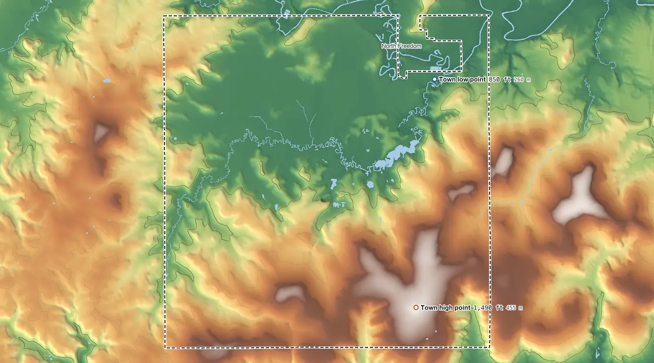Topographic elevation map of Freedom, Sauk County, Wisconsin, shaded from 850 ft on the northeast side to 1,490 ft on Happy Hill