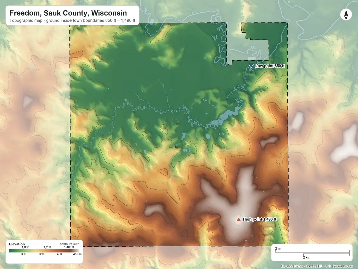 Topographic elevation map of Freedom, Sauk County, Wisconsin, shaded from 850 ft on the northeast side to 1,490 ft on Happy Hill