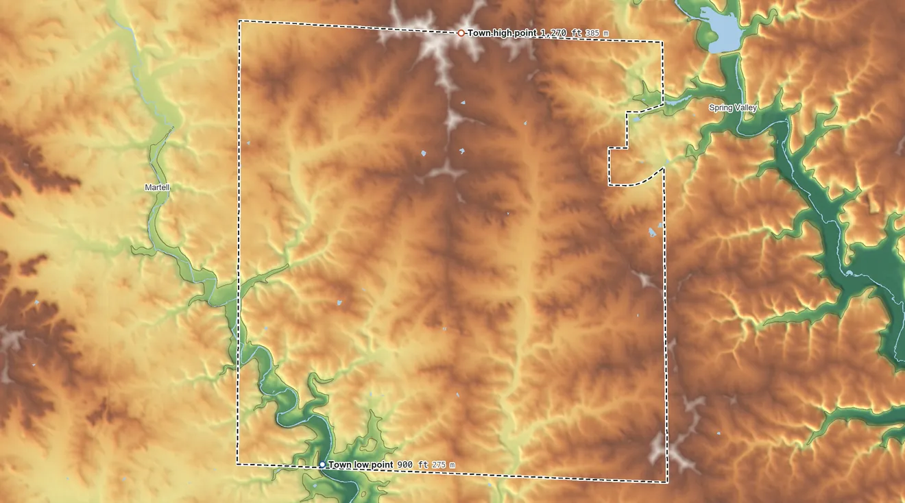 Topographic elevation map of Gilman, Wisconsin, shaded from 900 ft on the south side to 1,270 ft on the north side