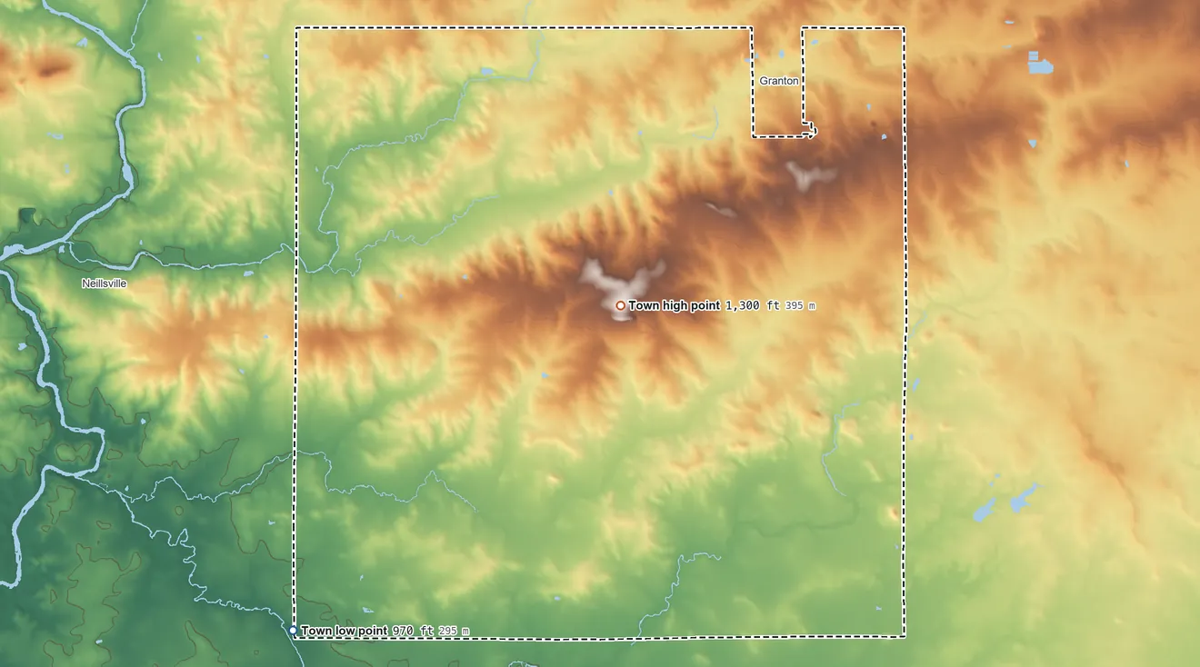 Topographic elevation map of Grant, Clark County, Wisconsin, shaded from 970 ft on the southwest side to 1,300 ft near the middle