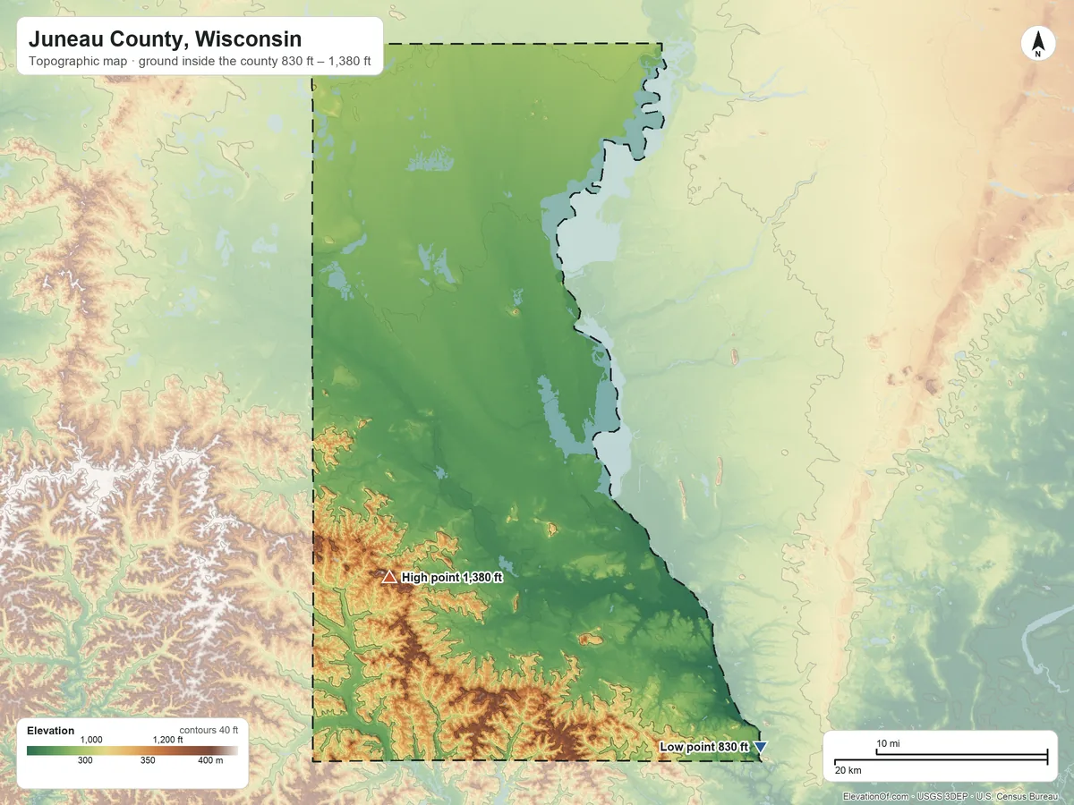 Topographic elevation map of Juneau County, Wisconsin, shaded from 830 ft on the southeast side to 1,380 ft on Johnson Hill