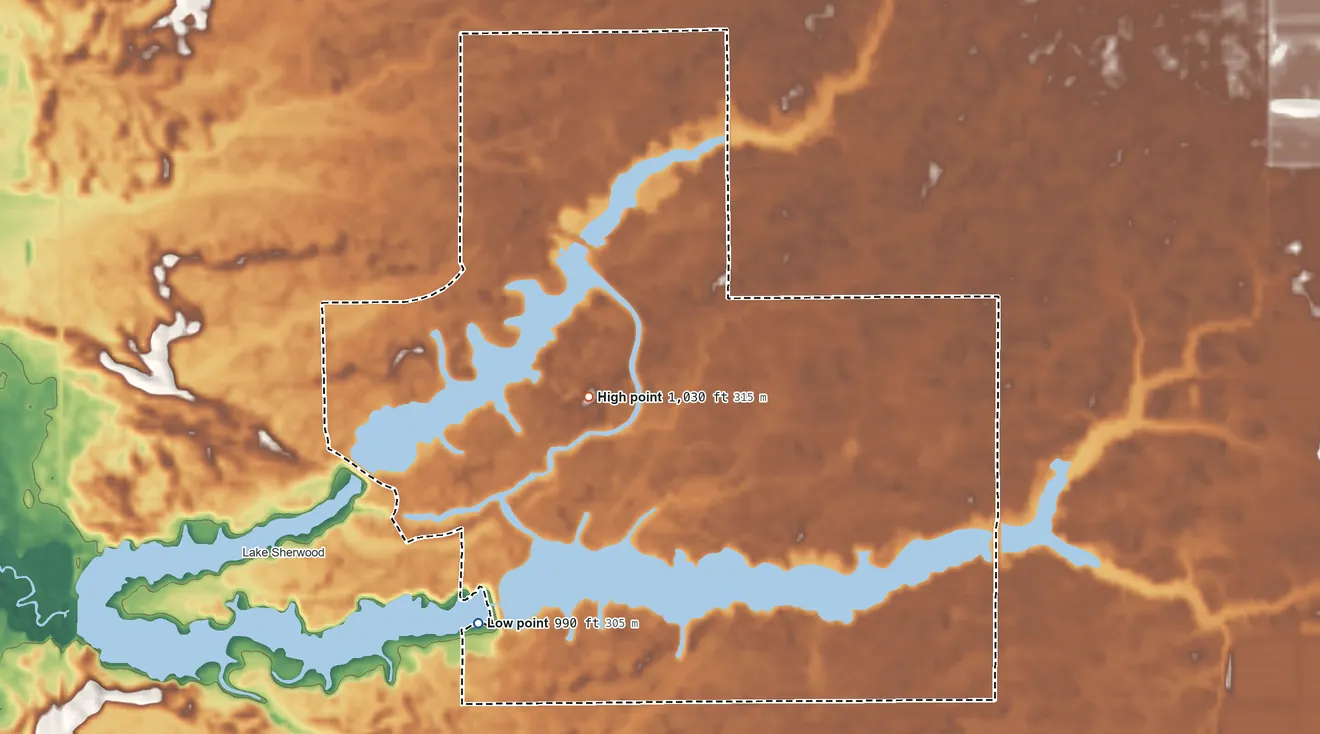 Topographic elevation map of Lake Camelot, Wisconsin, shaded from 990 ft on the southwest side to 1,030 ft near the middle