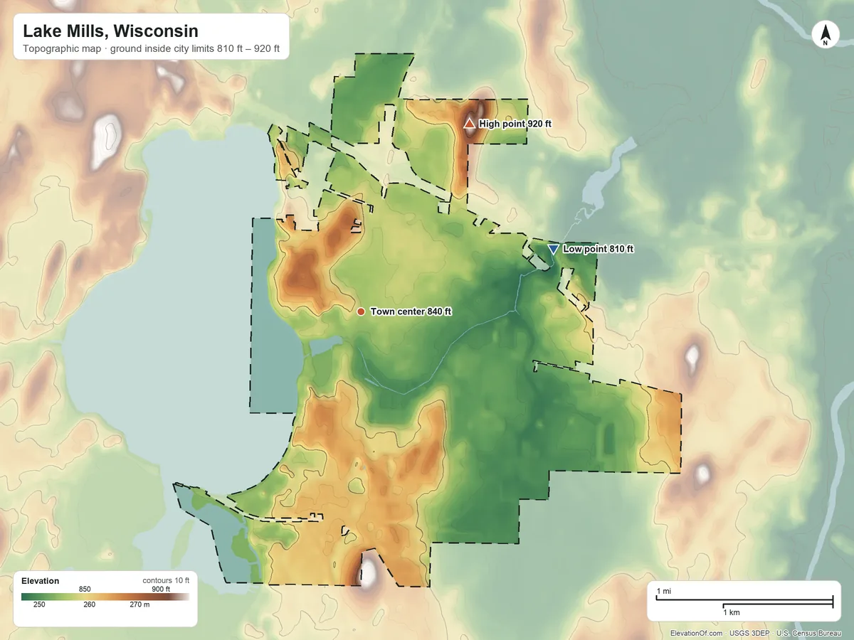 Topographic elevation map of Lake Mills, Wisconsin, shaded from 810 ft on the east side to 920 ft on the northeast side