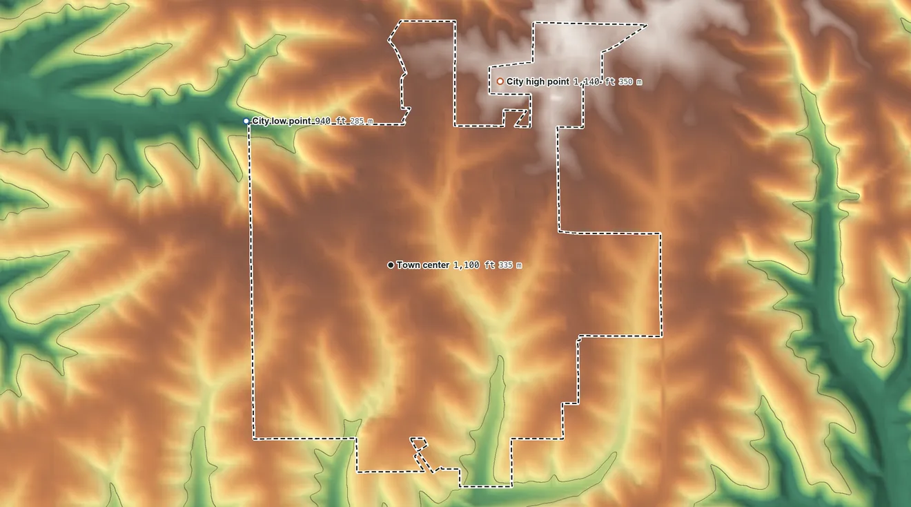 Topographic elevation map of Lancaster, Wisconsin, shaded from 940 ft on the northwest side to 1,140 ft on the northeast side