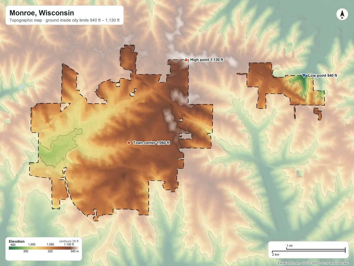 Topographic elevation map of Monroe, Wisconsin, shaded from 940 ft on the east side to 1,130 ft on the northeast side