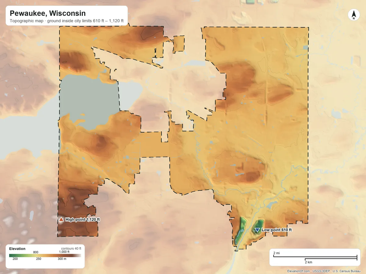Topographic elevation map of Pewaukee, Wisconsin, shaded from 610 ft on the southeast side to 1,120 ft on the southwest side