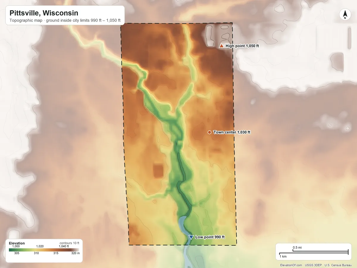Topographic elevation map of Pittsville, Wisconsin, shaded from 990 ft on the south side to 1,050 ft on the north side