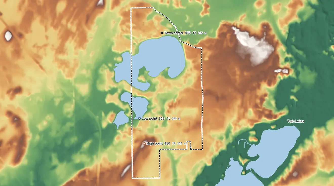 Topographic elevation map of Powers Lake, Wisconsin, shaded from 820 ft on the south side to 910 ft on the south side