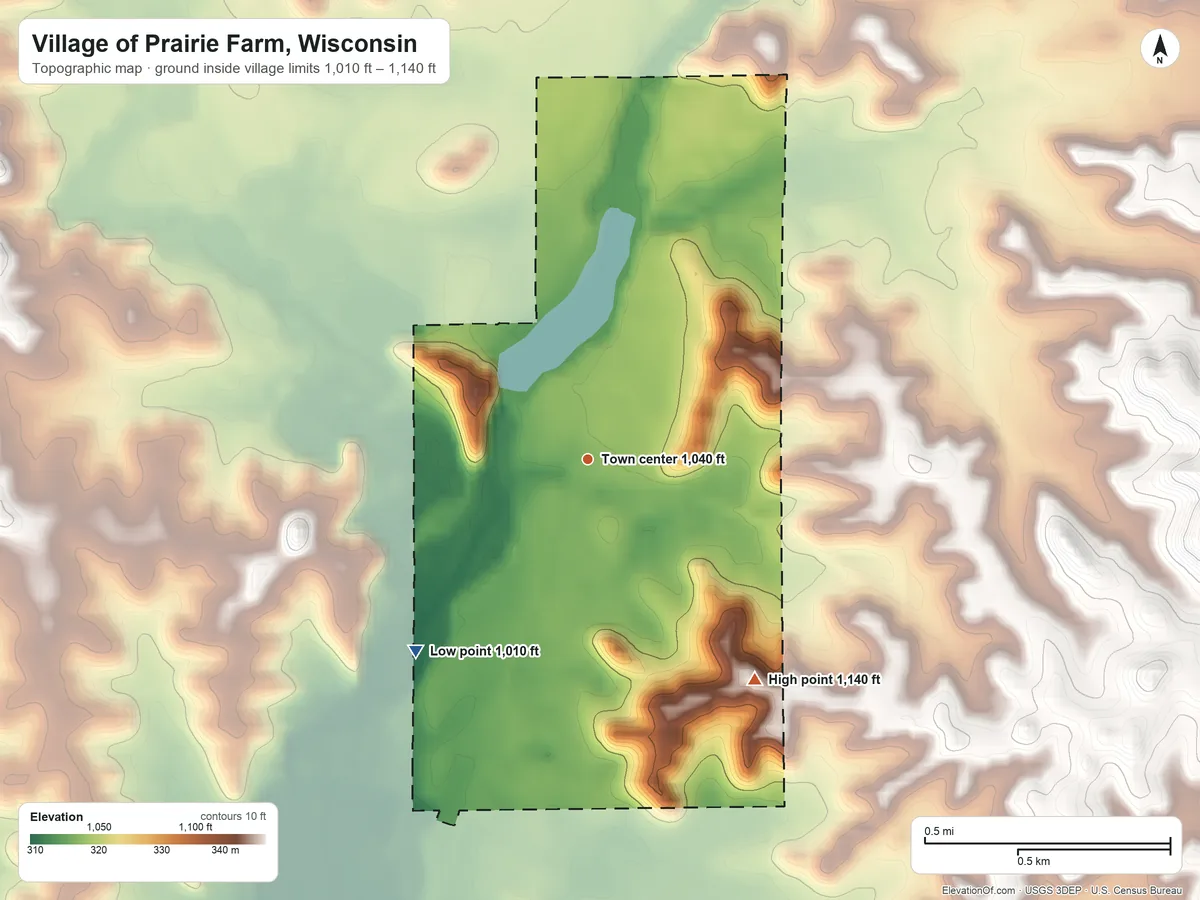 Topographic elevation map of Village of Prairie Farm, Wisconsin, shaded from 1,010 ft on the southwest side to 1,140 ft on the southeast side