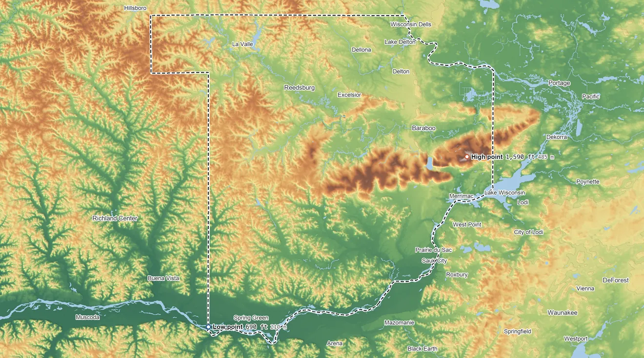 Topographic elevation map of Sauk County, Wisconsin, shaded from 690 ft on the southwest side to 1,590 ft on Sauk Point