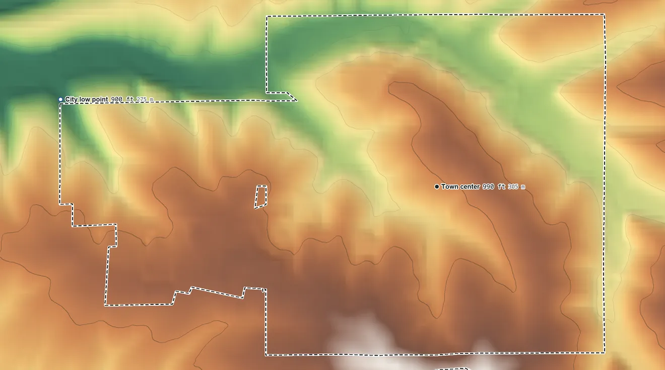 Topographic elevation map of Shullsburg, Wisconsin, shaded from 900 ft on the west side to 1,060 ft on the south side