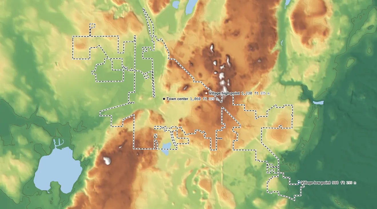 Topographic elevation map of Slinger, Wisconsin, shaded from 980 ft on the southeast side to 1,230 ft on the east side