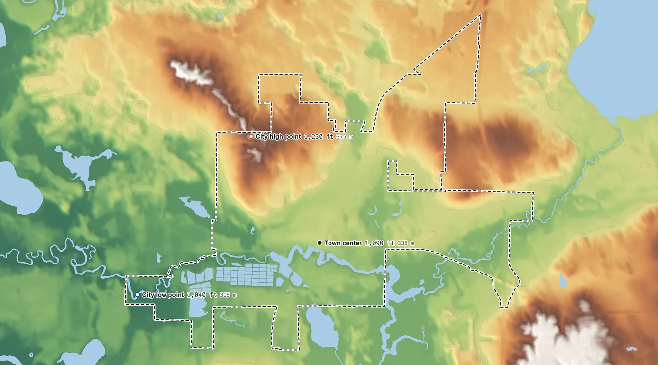 Topographic elevation map of Spooner, Wisconsin, shaded from 1,040 ft on the west side to 1,230 ft on the northwest side