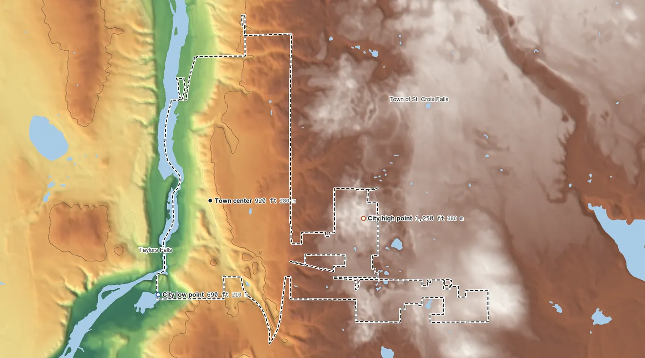 Topographic elevation map of St. Croix Falls, Wisconsin, shaded from 690 ft on the southwest side to 1,250 ft on the east side