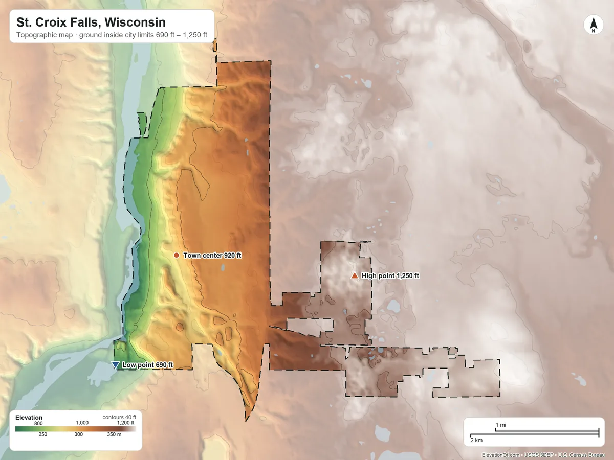 Topographic elevation map of St. Croix Falls, Wisconsin, shaded from 690 ft on the southwest side to 1,250 ft on the east side