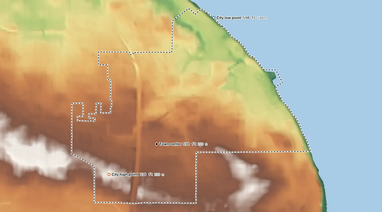 Topographic elevation map of St. Francis, Wisconsin, shaded from 590 ft on the northeast side to 730 ft on the southwest side