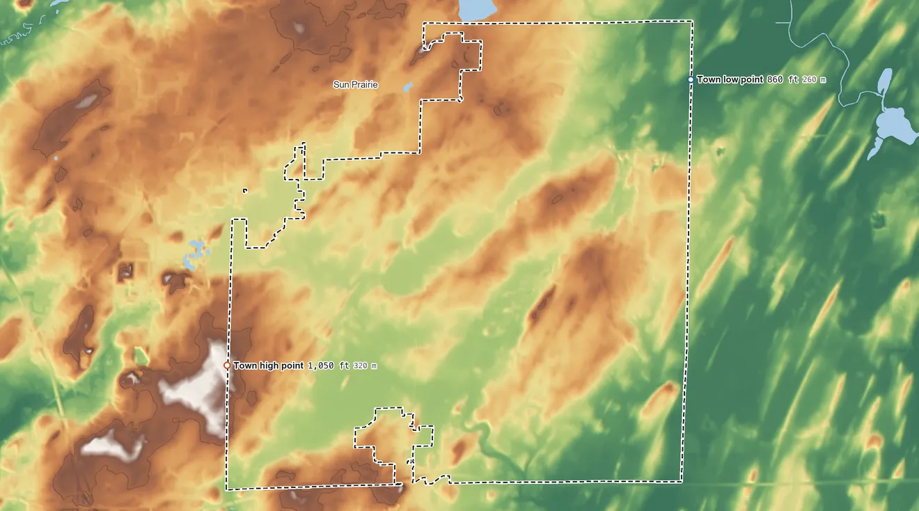 Topographic elevation map of Town of Sun Prairie, Wisconsin, shaded from 860 ft on the northeast side to 1,050 ft on the west side
