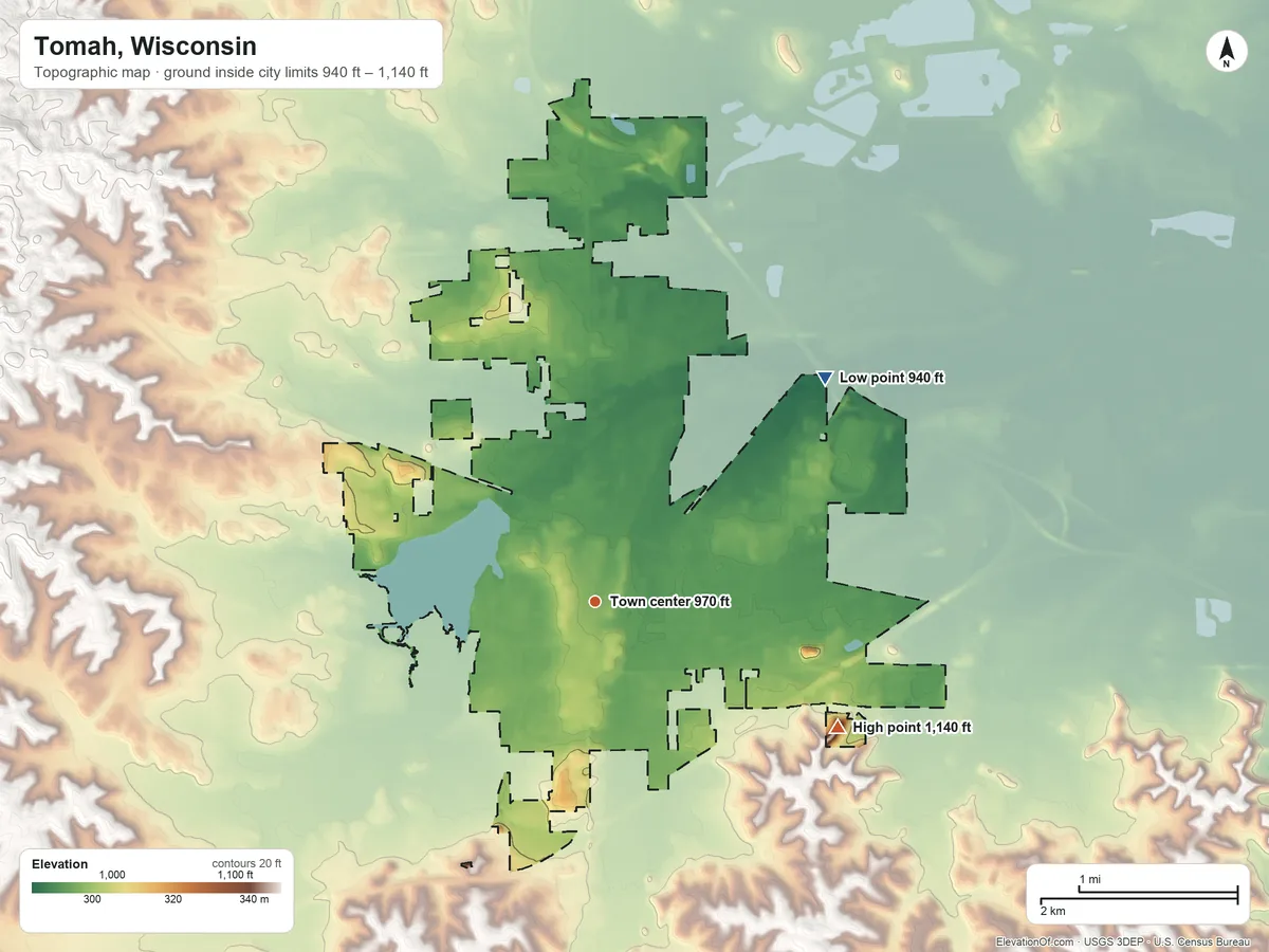 Topographic elevation map of Tomah, Wisconsin, shaded from 940 ft on the northeast side to 1,140 ft on the southeast side