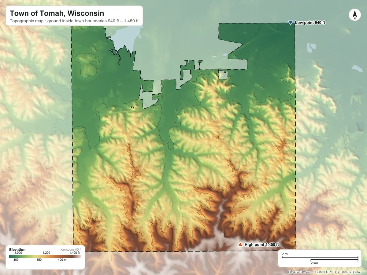 Topographic elevation map of Town of Tomah, Wisconsin, shaded from 940 ft on the northeast side to 1,450 ft on the southeast side