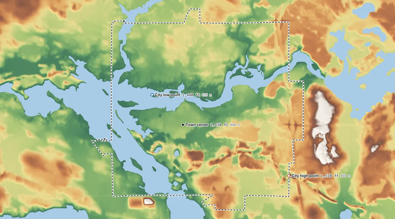 Topographic elevation map of Tomahawk, Wisconsin, shaded from 1,440 ft on the northwest side to 1,510 ft on the southeast side