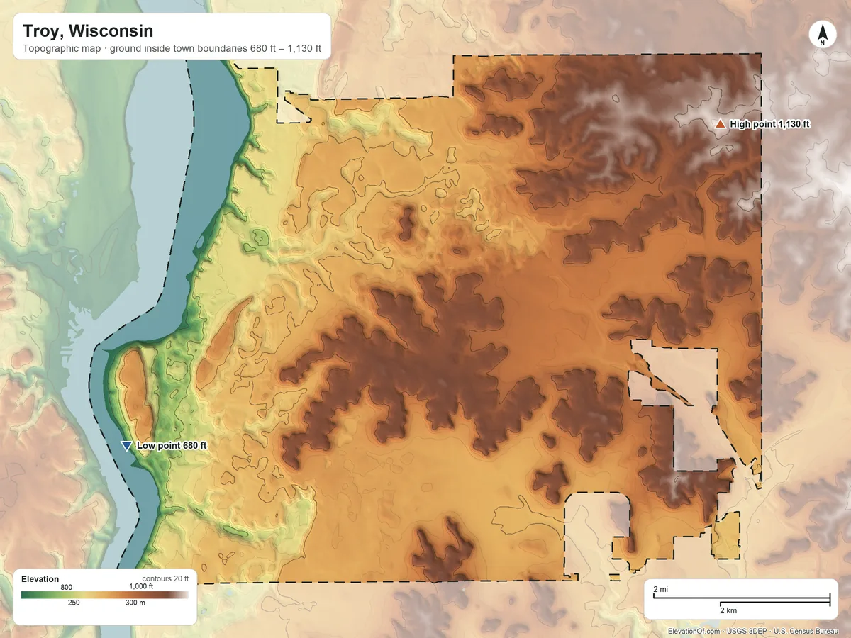 Topographic elevation map of Troy, Wisconsin, shaded from 680 ft on the southwest side to 1,130 ft on the northeast side