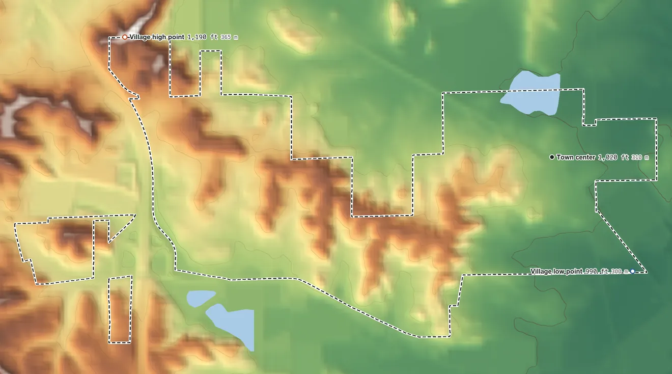 Topographic elevation map of Warrens, Wisconsin, shaded from 990 ft on the southeast side to 1,190 ft on the west side