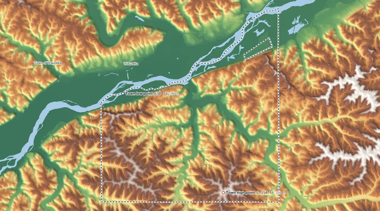 Topographic elevation map of Woodman, Wisconsin, shaded from 630 ft on the northwest side to 1,150 ft on the southeast side