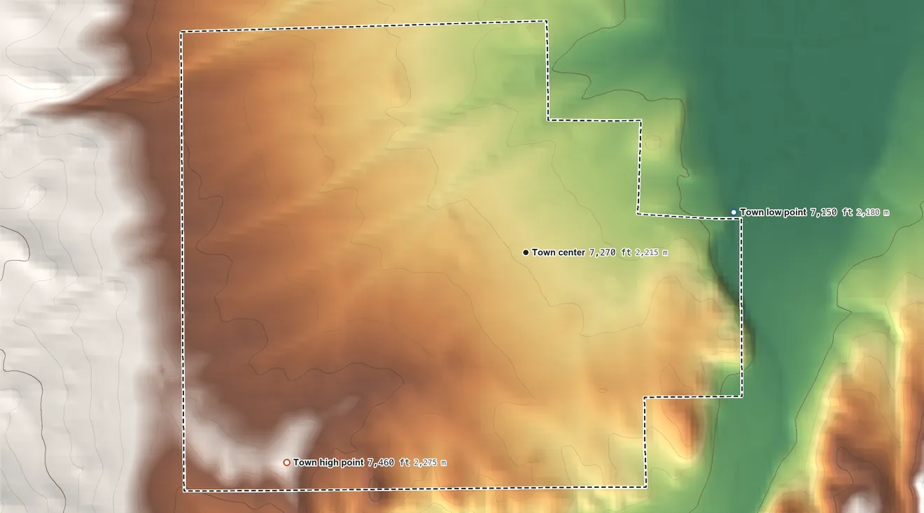 Topographic elevation map of Encampment, Wyoming, shaded from 7,150 ft on the east side to 7,460 ft at the foot of the Sierra Madre
