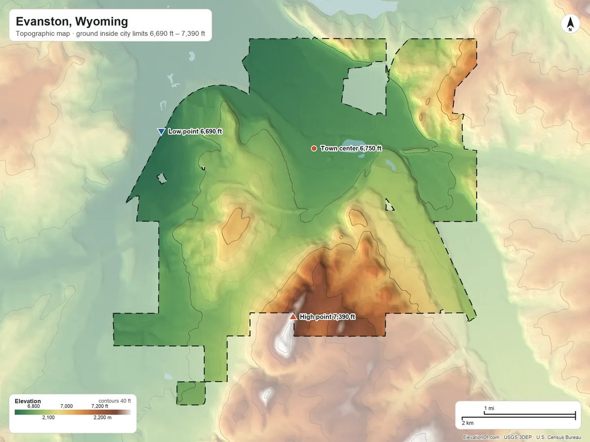 Topographic elevation map of Evanston, Wyoming, shaded from 6,690 ft on the west side to 7,390 ft on the south side
